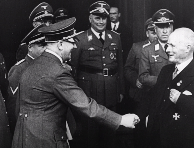 Adolf Hitler greets Gustav Krupp in front of his Essen estate on the occasion of his 70th birthday